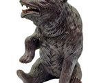a statue of a bear that is sitting on its hind legs