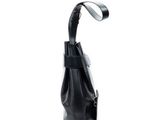 a black purse with a strap hanging from it ' s side