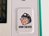 a close up of a game controller with a sticker on it