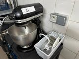 an image of a kitchen with a mixer and a bowl on the counter