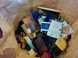 a bag full of books sitting on the floor