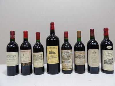 six bottles of wine are lined up in a row on a table