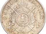 a close up of a coin with a crown on it