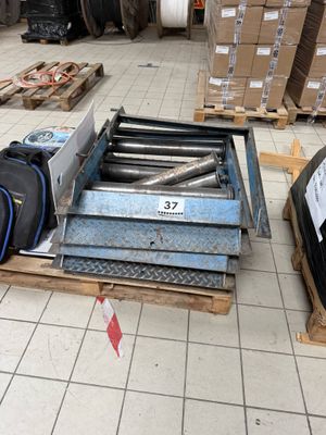 a pile of luggage sitting on a pallet in a warehouse