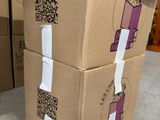 a stack of cardboard boxes with a qr code on them