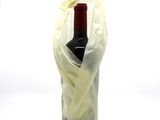 a bottle of wine wrapped in a plastic bag