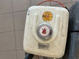 an image of a gas pump with a no smoking sign on it