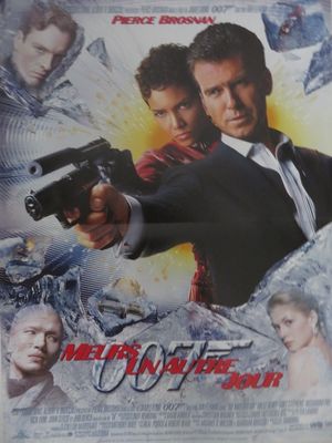 l'affiche du film « Men in Black », sur laquelle figurent deux hommes armés