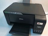 an image of a printer sitting on top of a white table