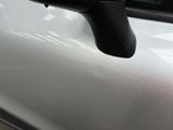 a close up of a car door handle on the side of the car