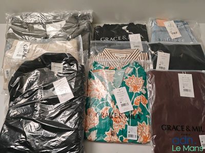 a lot of clothes that are sitting on a table
