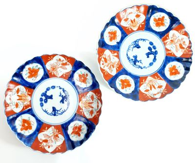 pair of blue and orange plates with floral designs on them