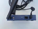 an image of a microphone and a receiver on a table