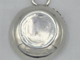 an image of a silver plate with a hole in the middle