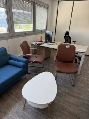 a blue couch and a blue chair in a room