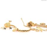 a lot of jewelry that is laying out on the table