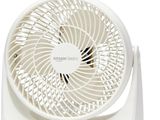 un ventilateur blanc posé sur une table