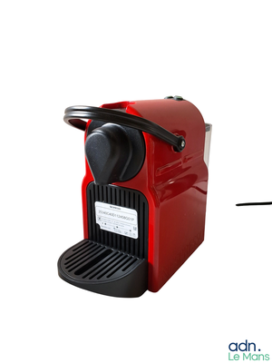 an image of a red coffee machine with a cup of coffee