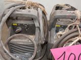 two welding machines with a price tag on them