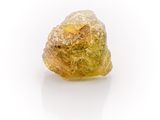 rough yellow diamond on a white background