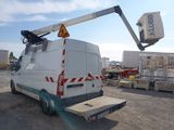 a white truck with a crane attached to it ' s back