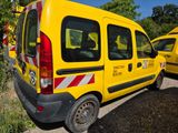 a yellow van that is parked next to other yellow cars