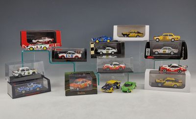 many different models of cars on display in a display case