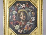un tableau représentant un jeune garçon avec une couronne de fleurs, dans un cadre doré