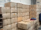 many boxes stacked on the floor in a room
