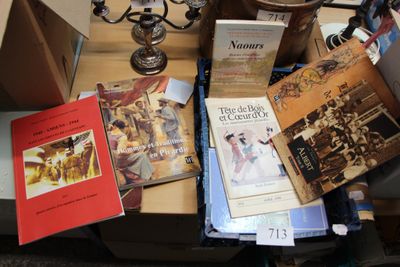 many books on a table with a candelab and a candelab