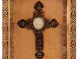 a close up of a cross with a picture of a person on it