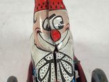 a toy car with a clown on the front of it