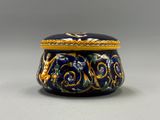 une image représentant une boîte bleue et jaune ornée d'un motif floral