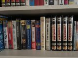 many dvds on the shelf in the room