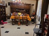 a dining room with a table and chairs and a chandelier