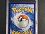 a close up of a pokemon card in a plastic case