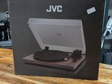 an open box of a record player sitting on top of a wooden table
