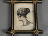 portrait of a woman in a black and gold frame with a cross on it