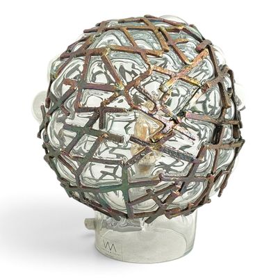 a sculpture of a ball made out of old keys