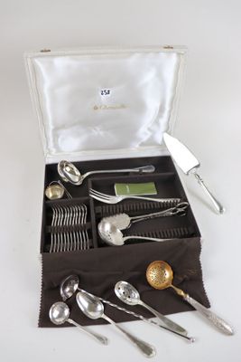 a box with silverware in it on a white surface