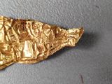 a piece of gold that has been placed on top of a table