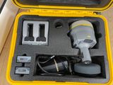 a yellow case with a camera and other items in it