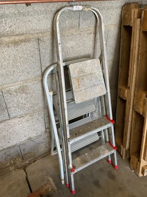 a ladder that is leaning against a wall in a garage