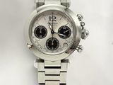 a close up of a watch on a white surface