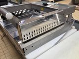 a machine that is sitting on a table in a kitchen