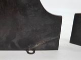 pair of black metal bookends on a white background