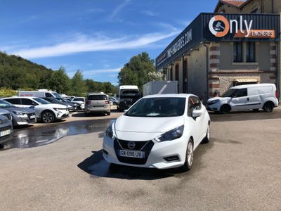 a white car that is parked in front of a building
