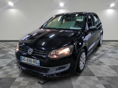 a picture of a black vw golf in a showroom