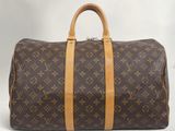 Sac Keepall Louis Vuitton en toile Monogram et cuir