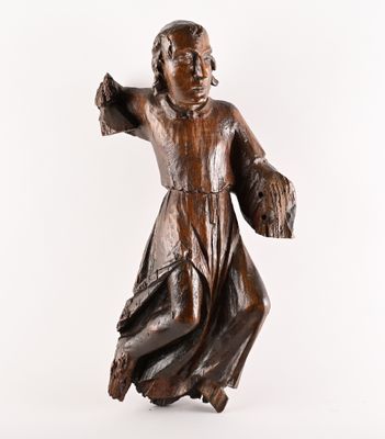 statue of a woman in a brown dress with her arms outstretched